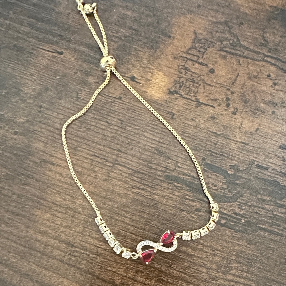 Elegant Gold and Red Infinity Bracelet